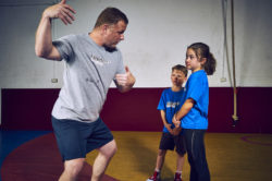 Athlete Pro young rookie coach train wrestling technique form