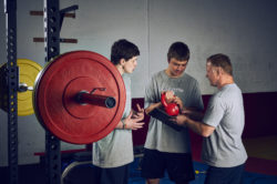 Athlete Pro wrestling strength conditioning coaching weights